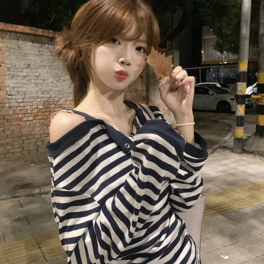 Dark blue Korean-style oversized women's T-shirt with embroidered stripes and button details on long sleeves