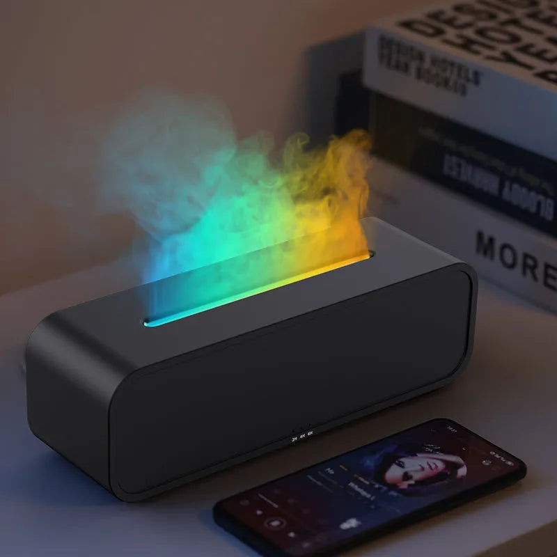 Black and white aroma diffuser with flame effect and colour-changing lights showing remote control