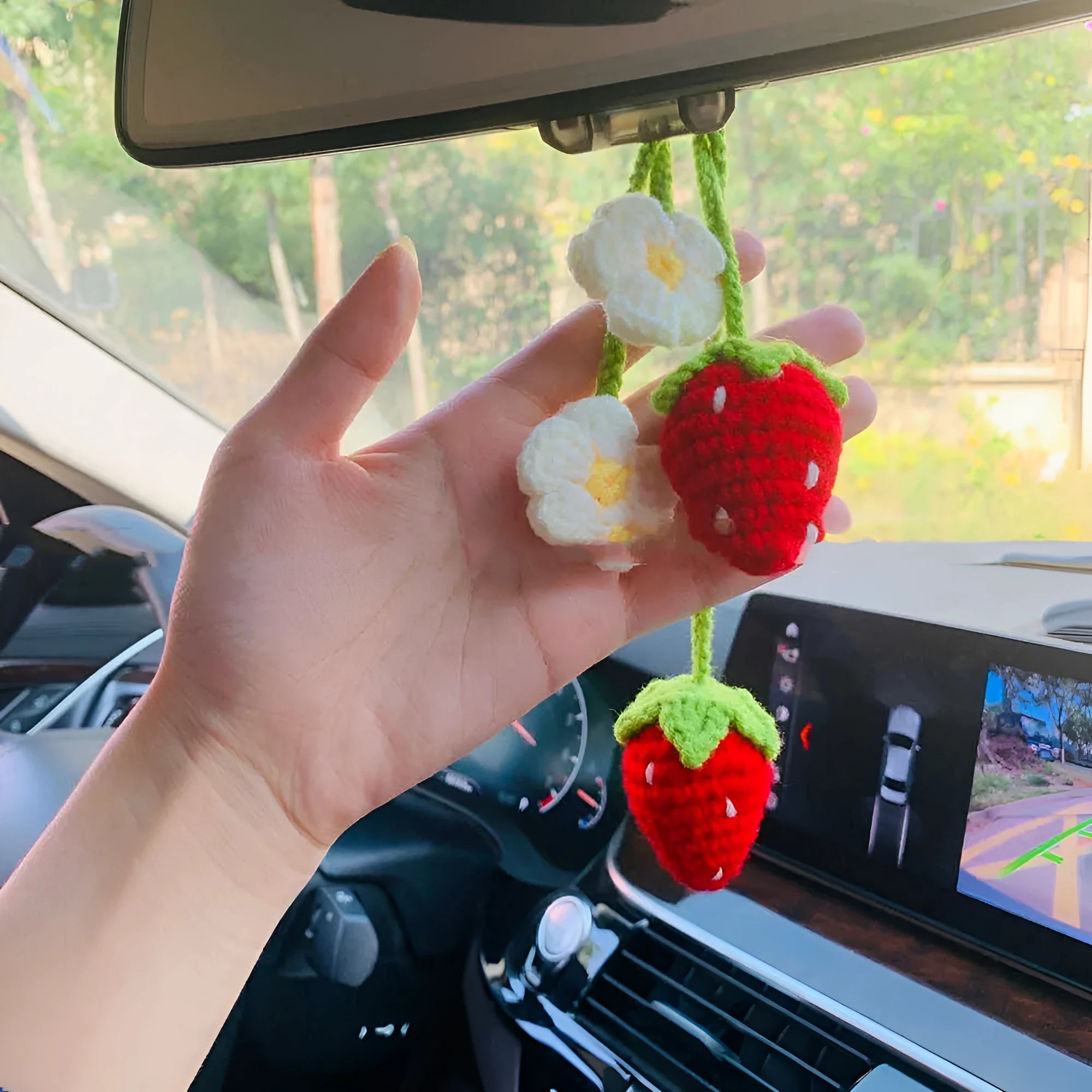 Handwoven strawberry-shaped car pendant made from natural cotton and hemp fibres.