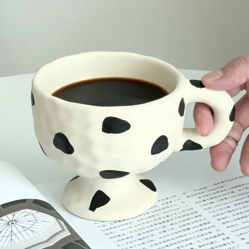 Hand-pinched irregular shaped ceramic mug in solid colour, 250ml capacity
