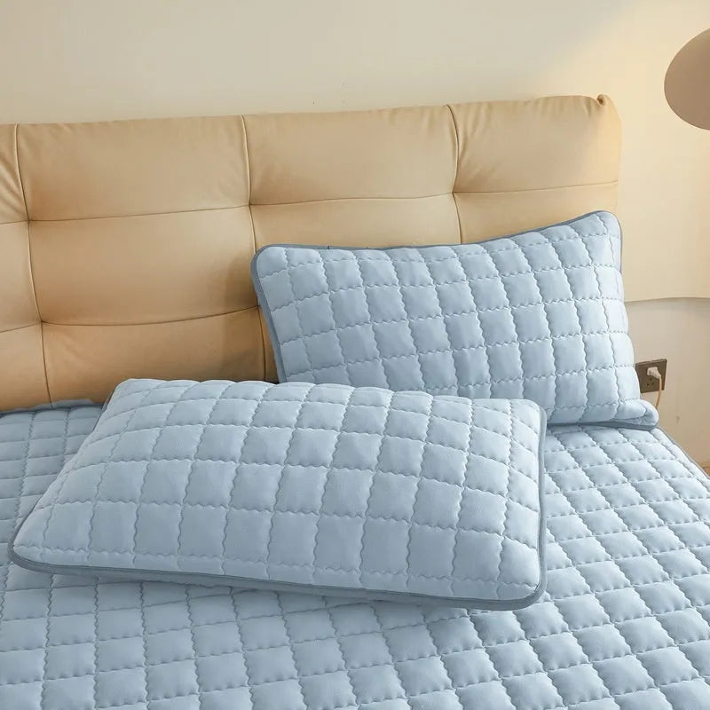 Class A waterproof washed cotton fitted sheet in blue, shown fitted on a mattress corner.