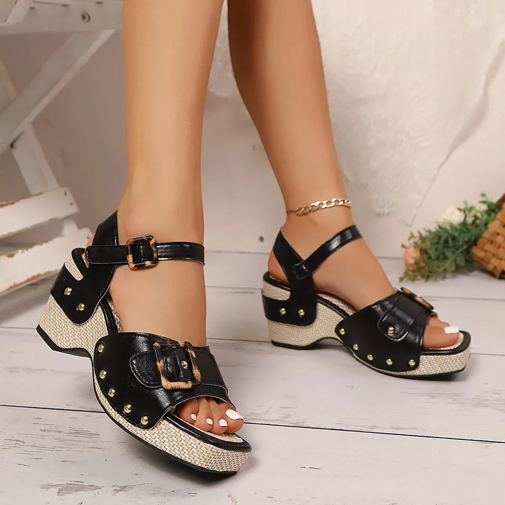Pair of female button metal buckle beach chunky heel sandals in black with square toe and rubber sole