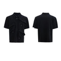 Men's black loose-fit polo shirt with a geometric grey and white pattern on the collar.