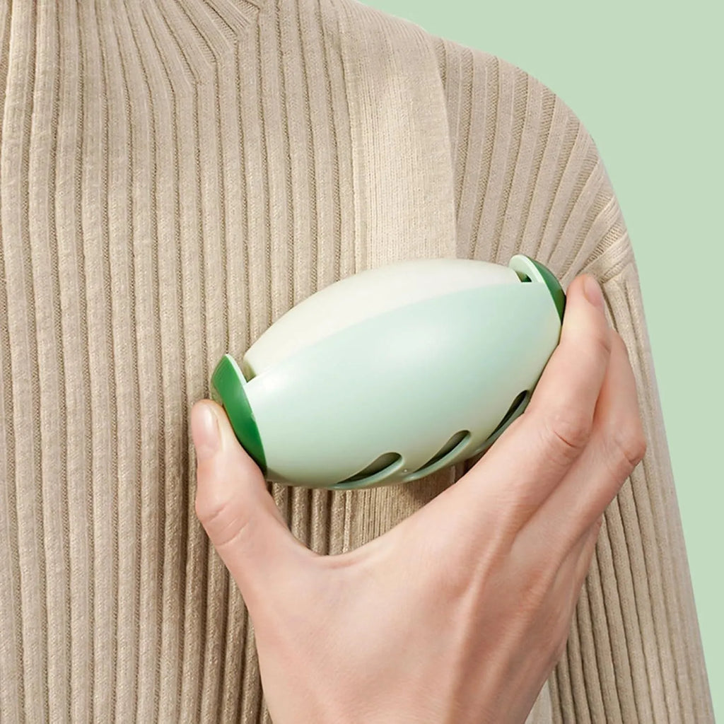 Green and white reusable gel lint roller ball for washing and removing pet hair