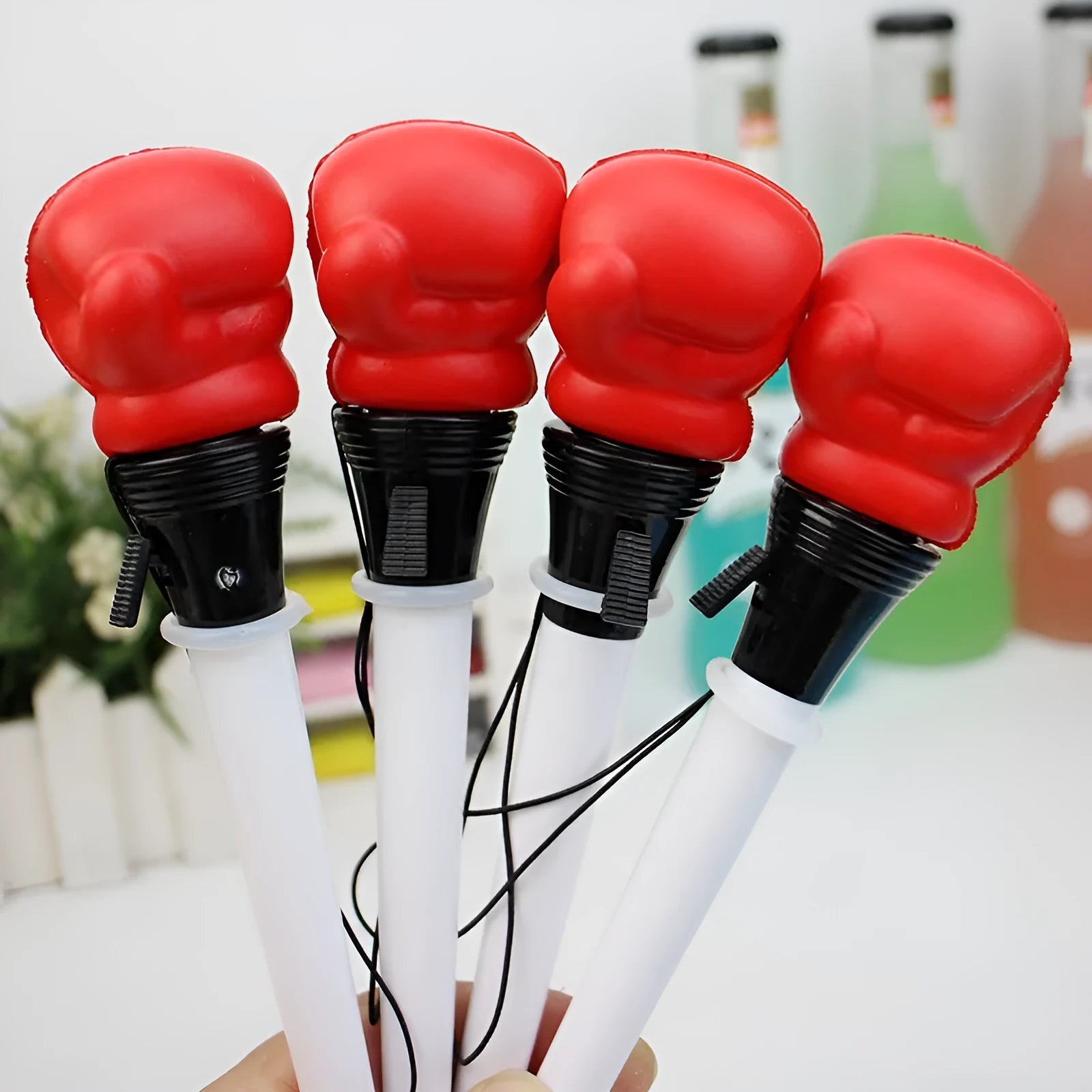 Four pressure relief boxing press ejection pens with 0.7mm bullet tips and black ink