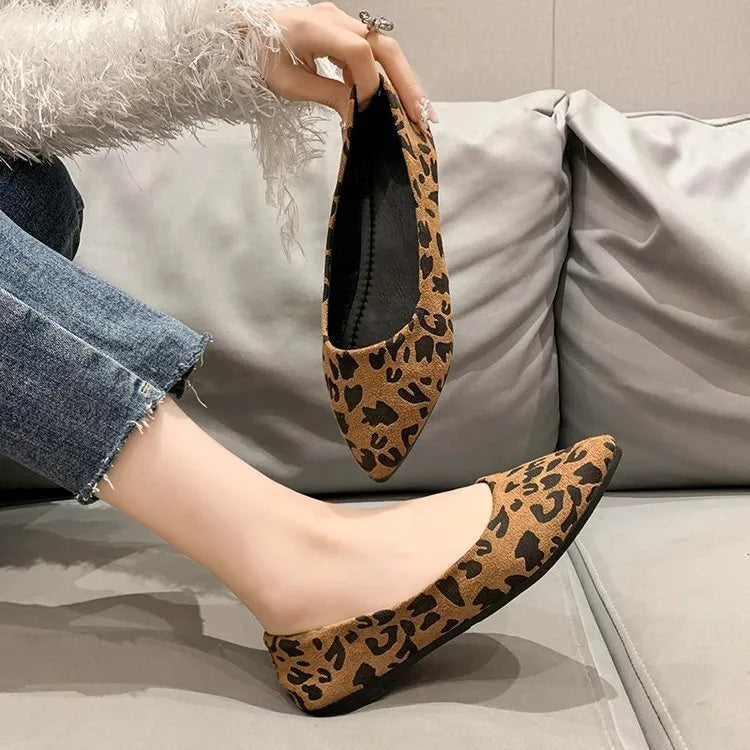 Women's flat pointed toe pumps with leopard print, cotton cloth upper, and low flat heel