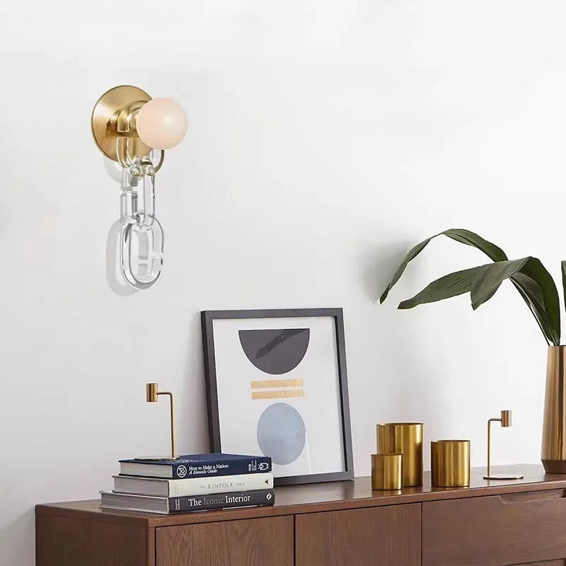Simple glass ball bedroom wall lamp with black base and milky white chain, warm LED light