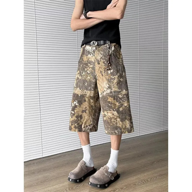 Yellow snake pattern camouflage cropped jeans showing detailed tooling print and denim construction