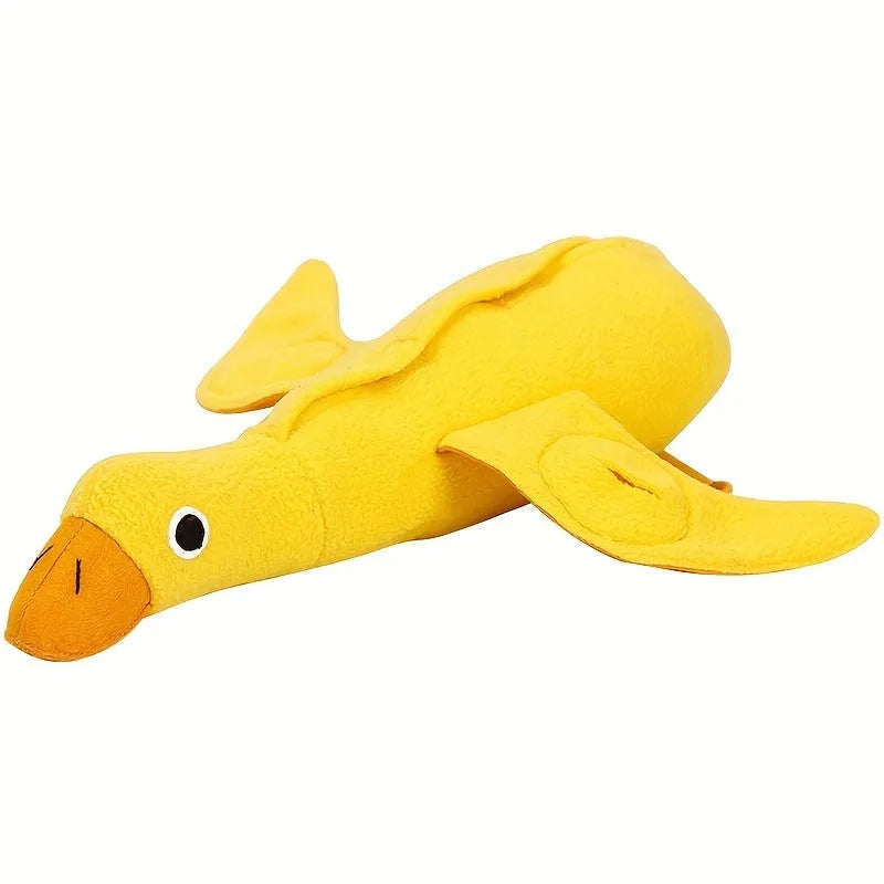 Yellow plush teddy duck dog training toy with squeaker and treat dispensing compartment.