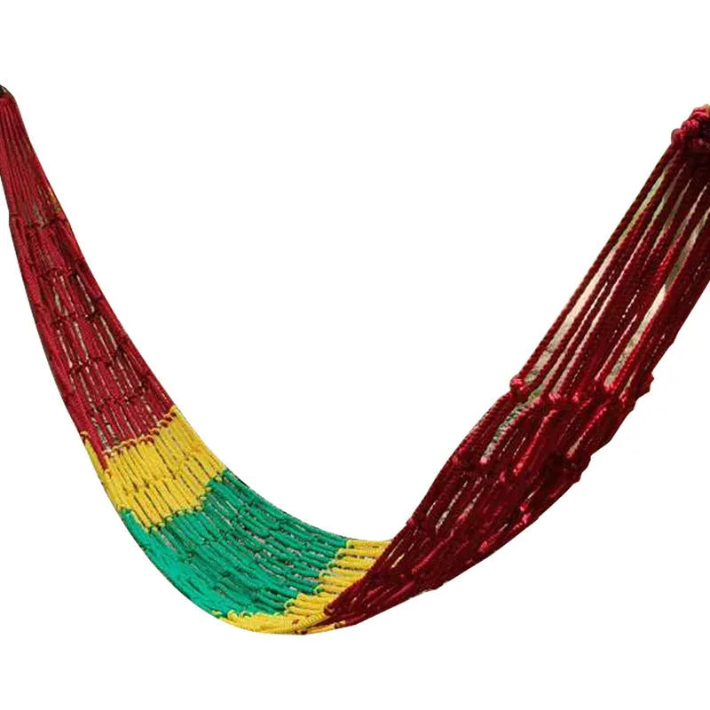 Nylon rope mesh outdoor hammock hung between two trees, showing its open weave and included tying ropes.