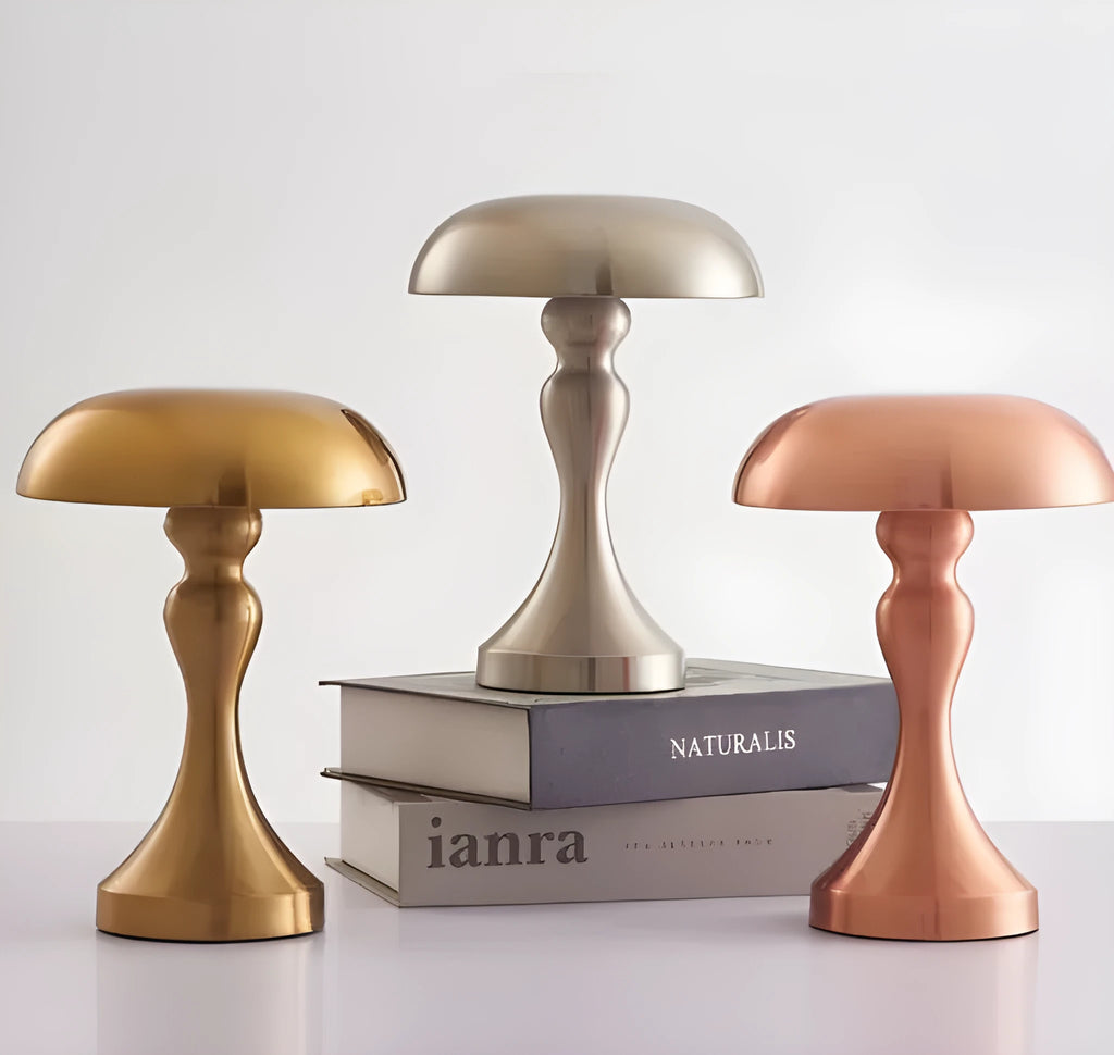 Metallic-finish touch-control LED desk lamp showing three colour light modes on a wooden desk.
