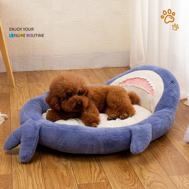 Blue shark pattern velvet pet bed cushion with thick padding on a wooden floor