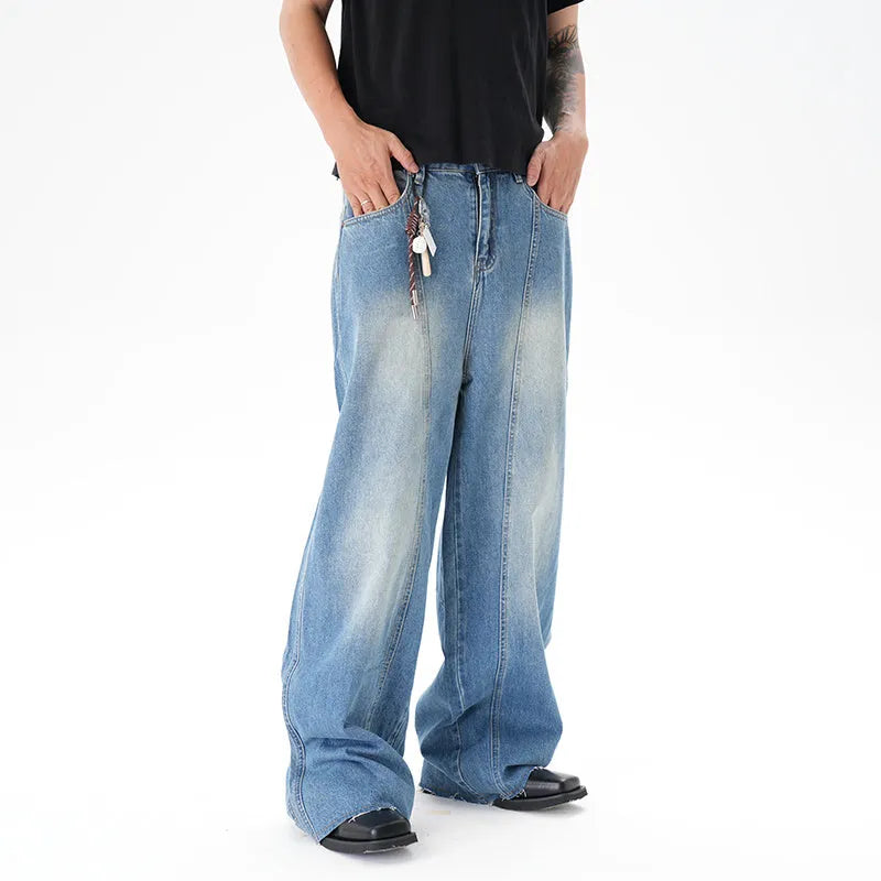 Light blue vintage washed wide leg machete jeans with zip fly on a model