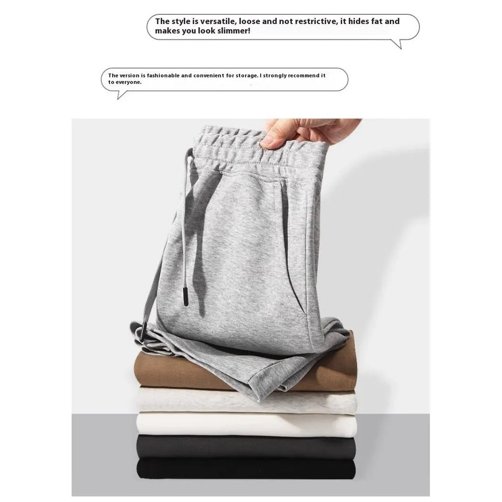 Men's straight-leg cotton sports shorts in light grey with an elastic waistband, laid flat.