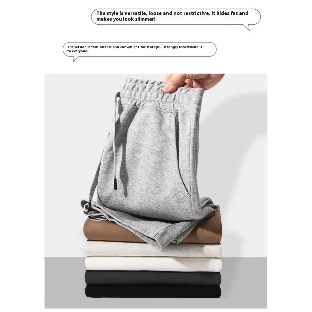Men's straight-leg cotton sports shorts in light grey with an elastic waistband, laid flat.