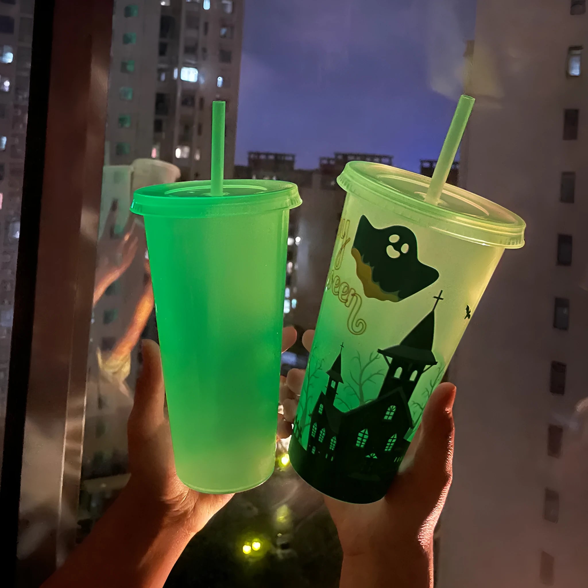720ml colourful plastic Halloween sippy cup with a straw on a table.