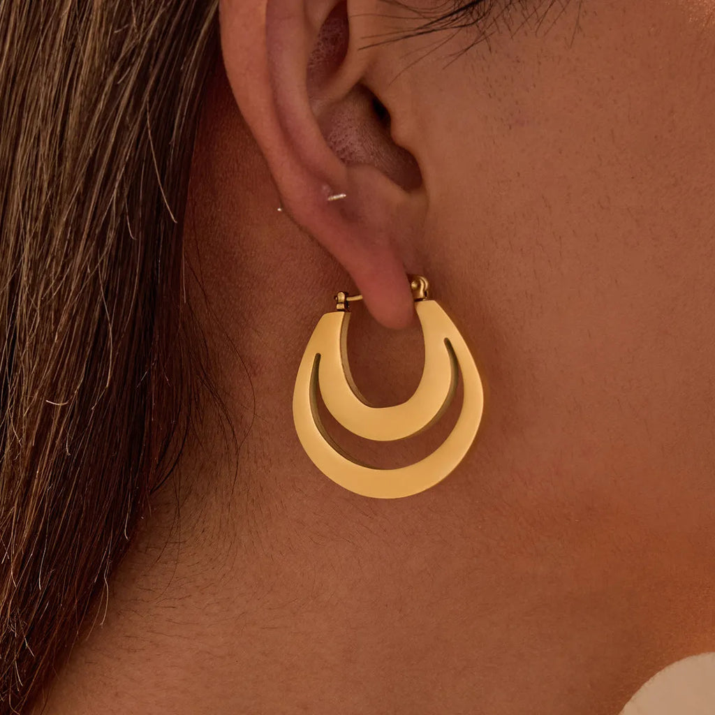 Geometric French earrings with 18K gold plating on stainless steel, featuring round ring elements in minimalist design