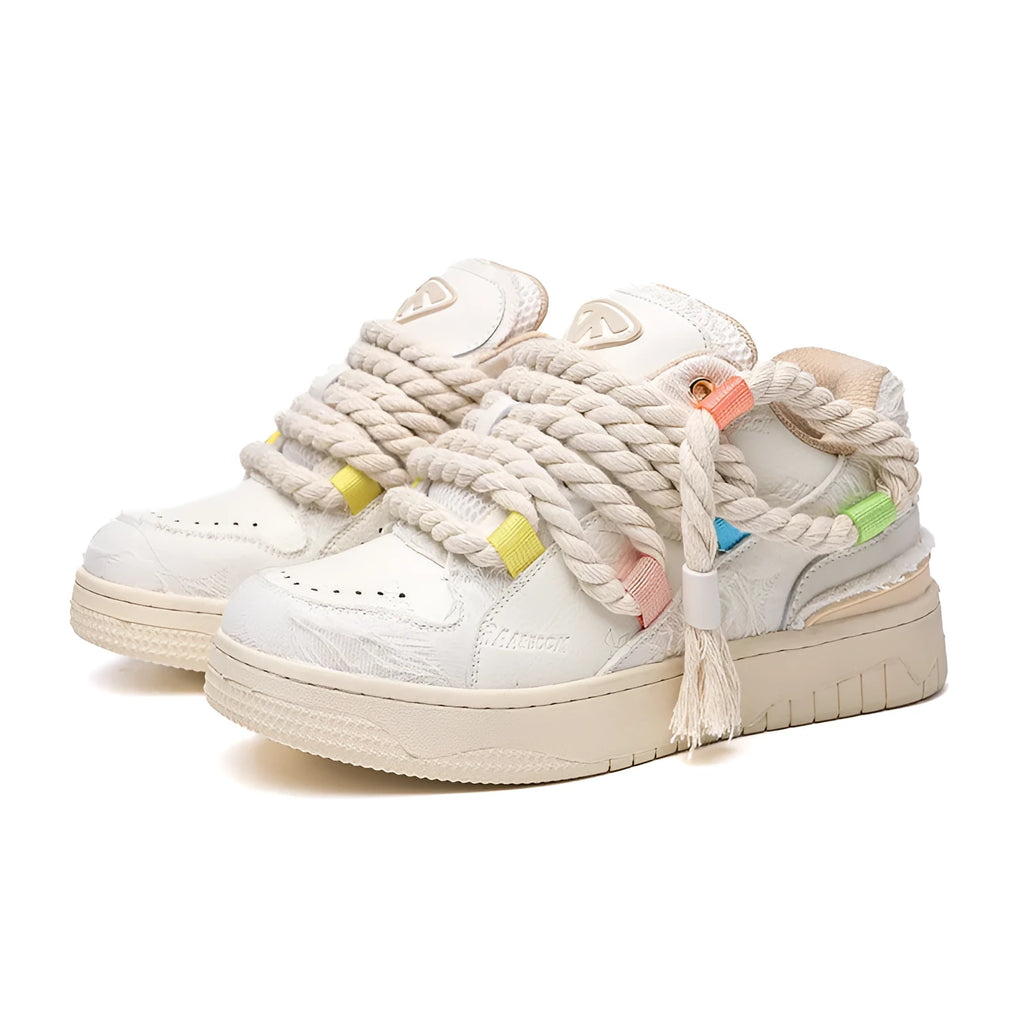 Old Damage brand creamy white retro skate shoes with low platform heel and lace-up front.
