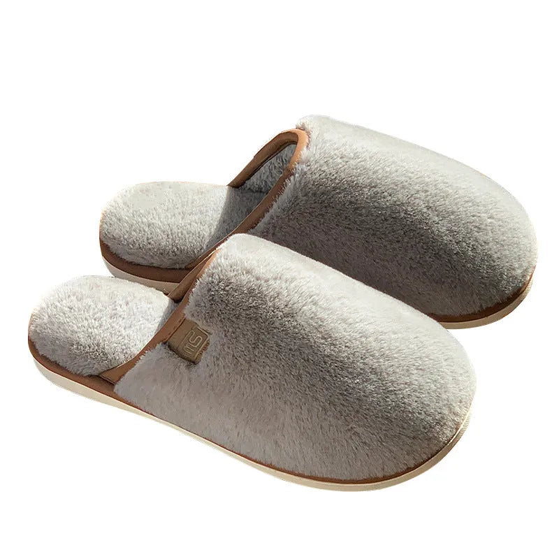 Unisex solid colour plush slippers with non-slip PVC soles and car stitching detail