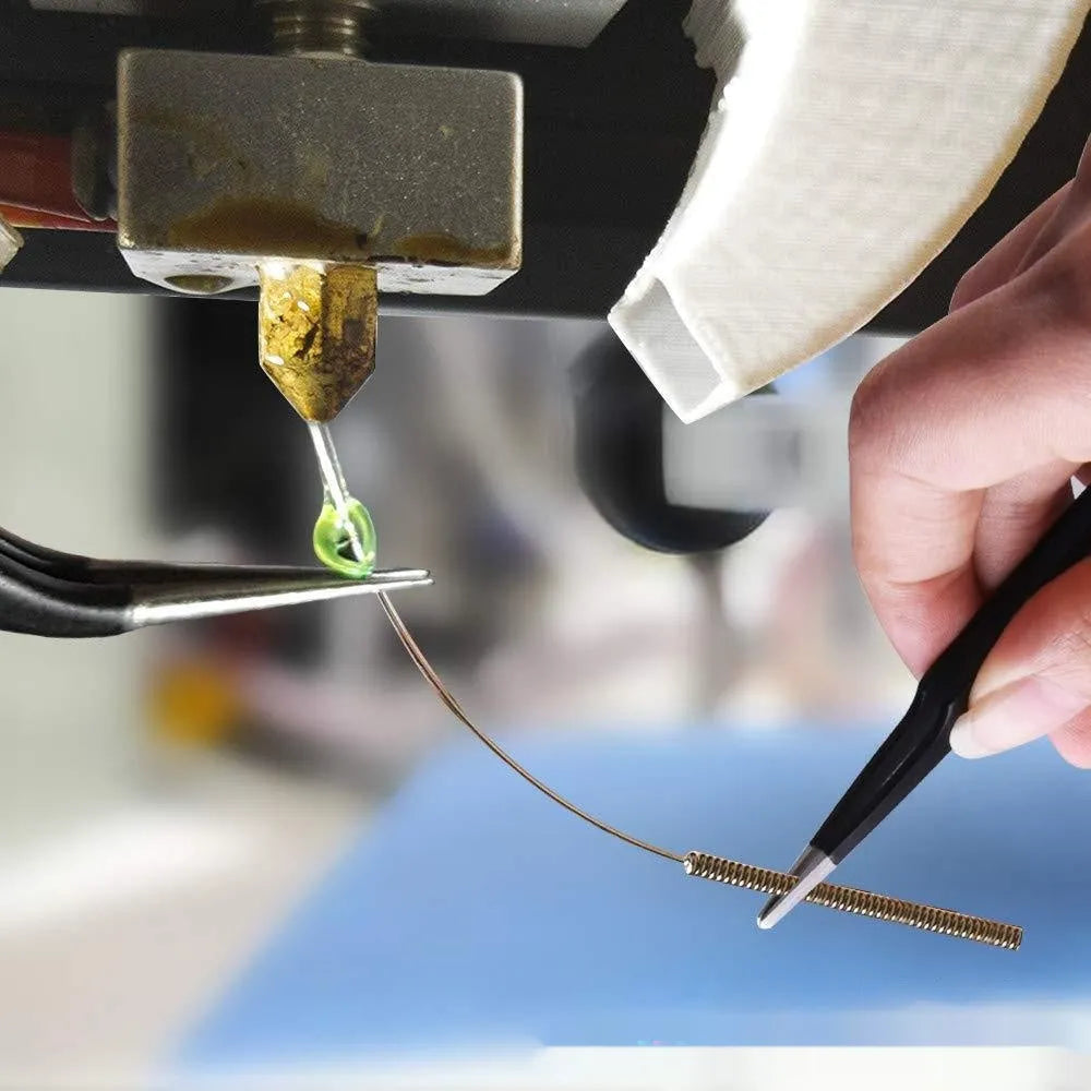 MK8 brass 3D printer nozzle and stainless steel cleaning pin kit on a white background