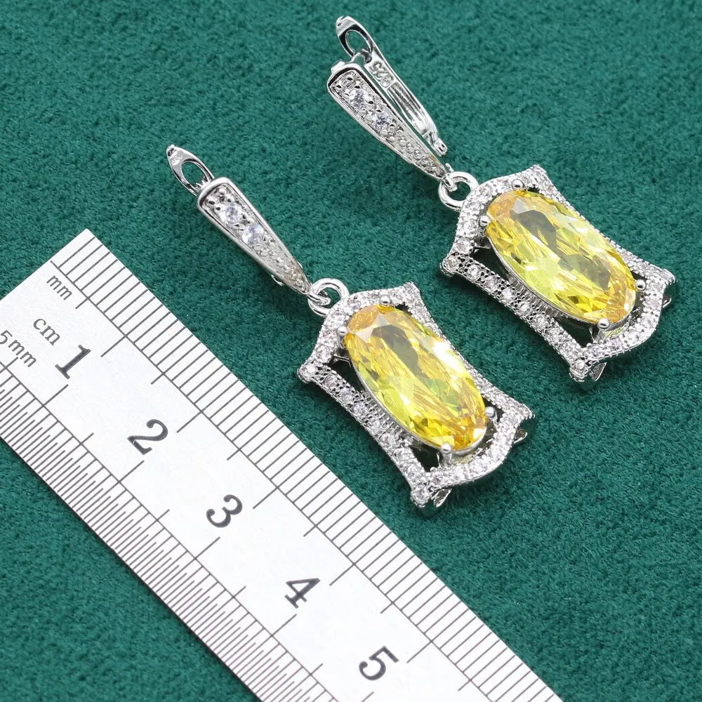 Yellow anti-allergy zircon jewellery set showing necklace, earrings, ring, and bracelet on a snake bone chain.