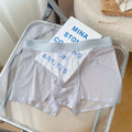 Men's seamless boxer shorts in nylon, shown in light brown colour, displaying thin fabric and mid-waist fit.
