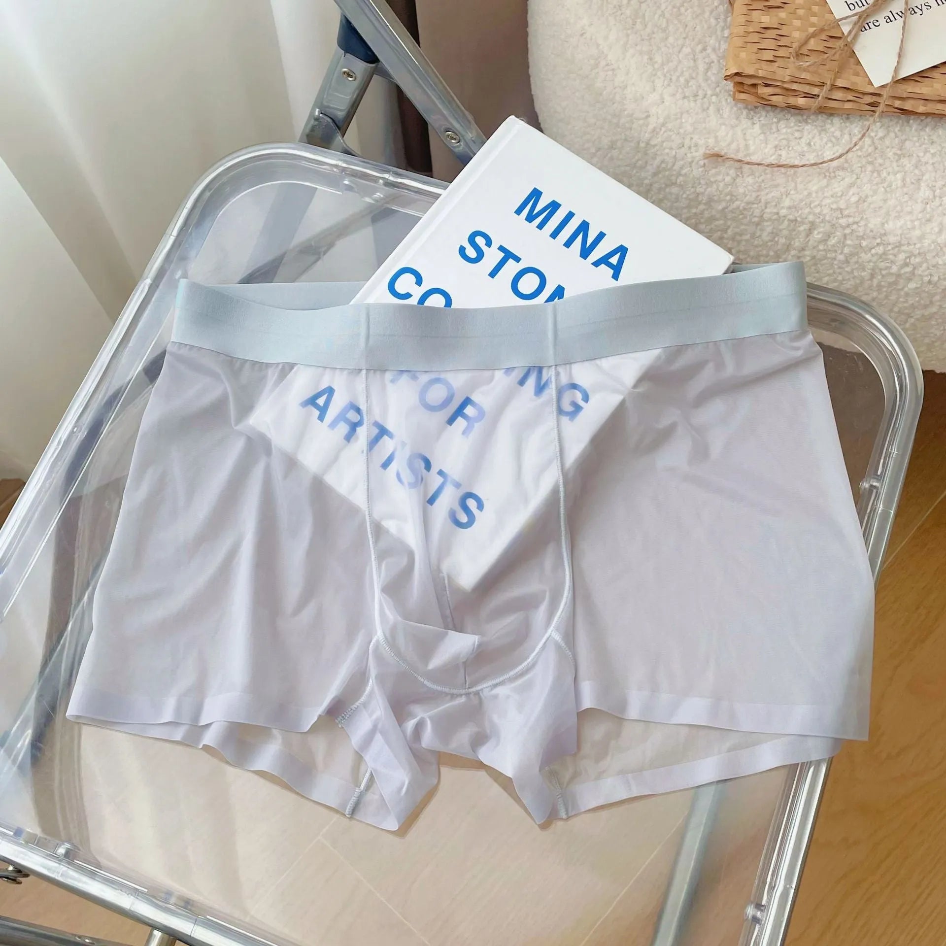 Men's seamless boxer shorts in nylon, shown in light brown colour, displaying thin fabric and mid-waist fit.