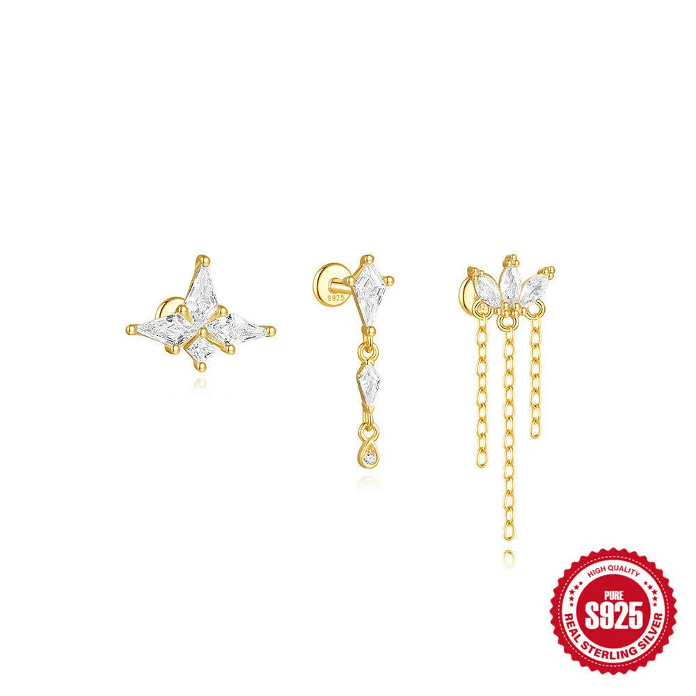 Geometric kite-shaped sterling silver earrings with rhinestones and a dangling chain tassel in a gold colour.