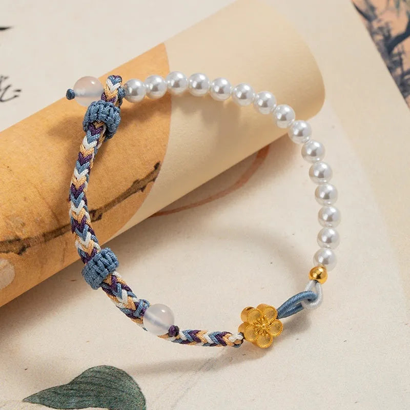 Colorful electroplated cord carrying strap with pearls and flowers and a sterling silver chalcedony charm
