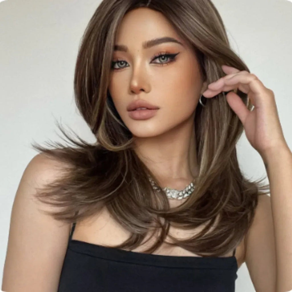 Mid-length full-head wig with long curly hair, bangs, and platinum gradient colour