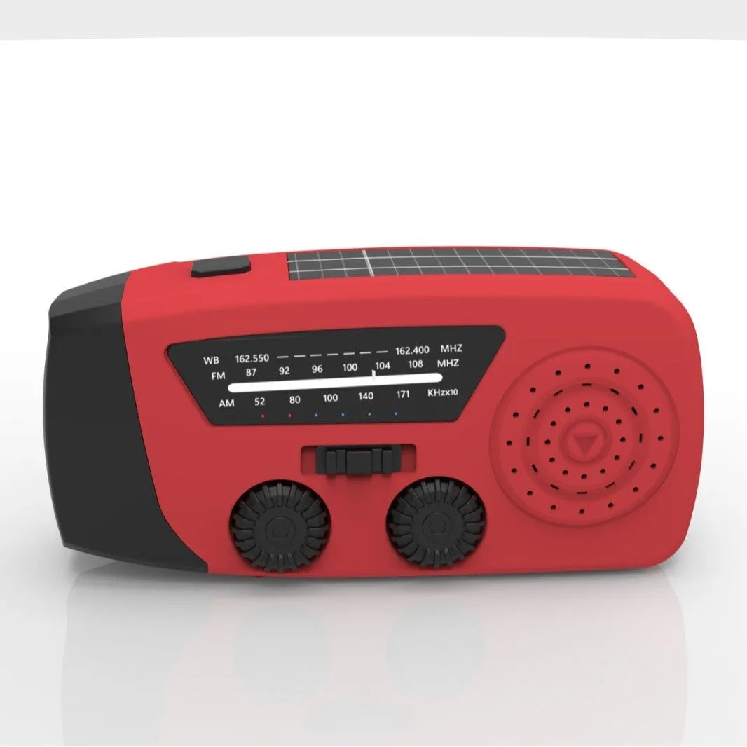 Red emergency rechargeable hand radio torch with wrist strap showing USB port and control buttons