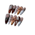Handmade leopard, cross, and flower print nail stickers in four sizes on a backing card.