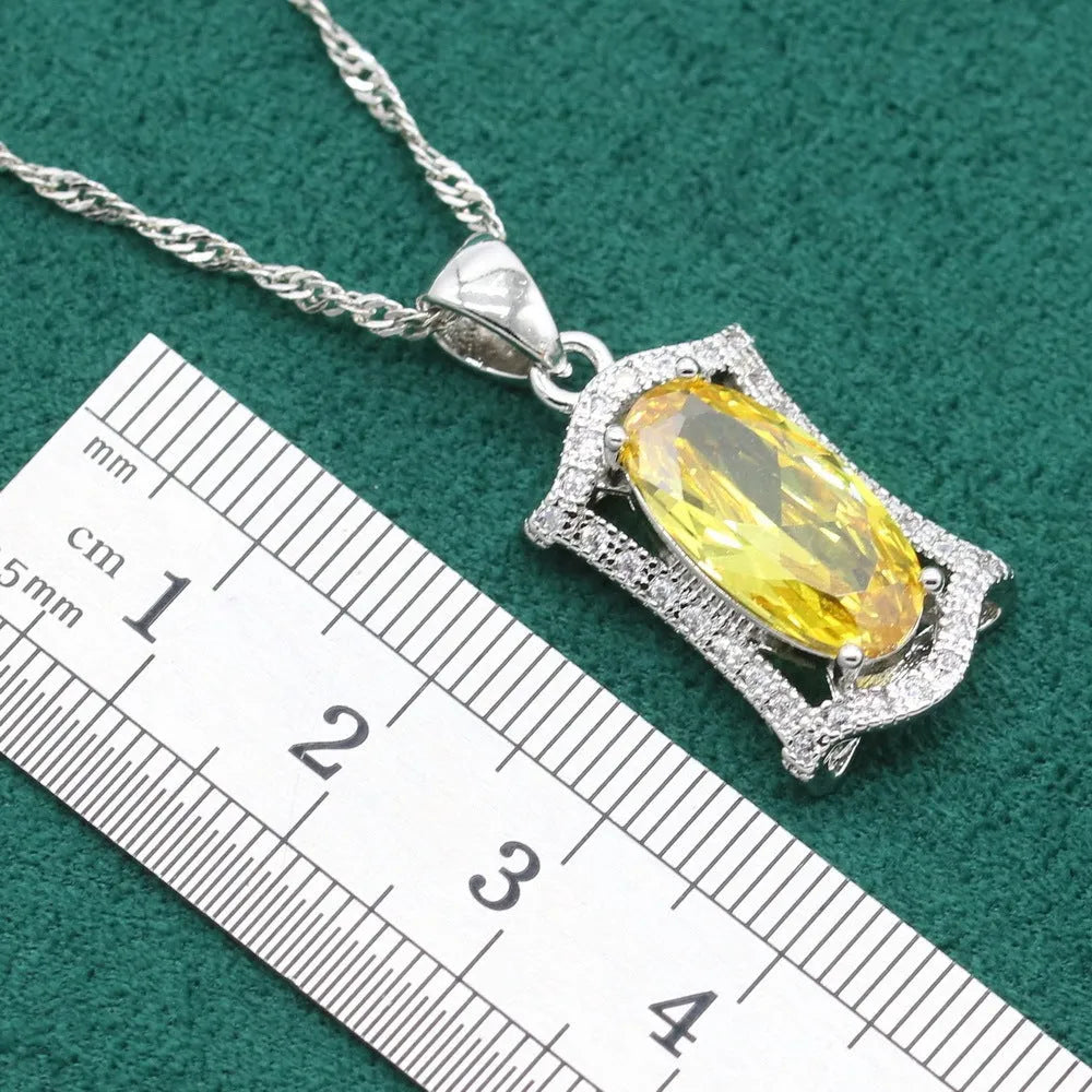 Yellow anti-allergy zircon jewellery set showing necklace, earrings, ring, and bracelet on a snake bone chain.
