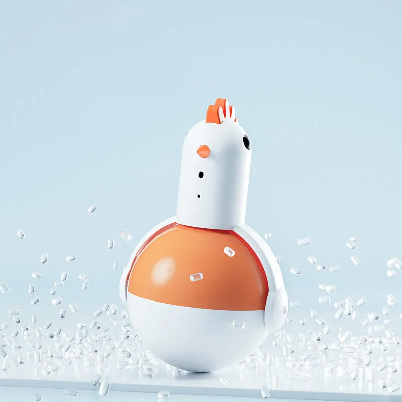 Green electric cat toy chicken with laser light and sound functions on flat surface