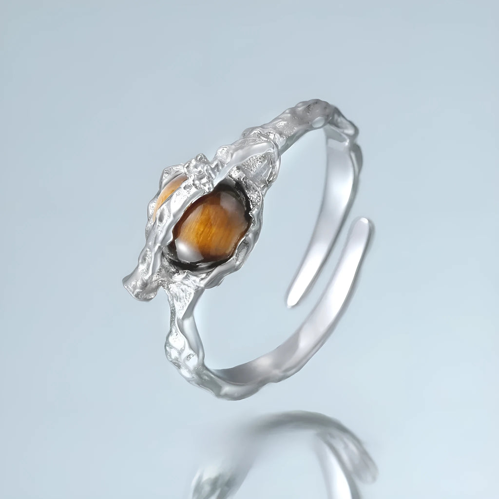 Women's Saturn design open ring with adjustable silver band and tigereye stone detail
