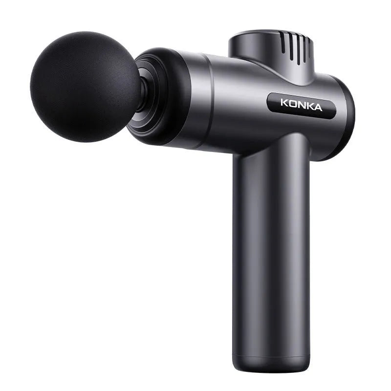 Konka V19 grey professional mini massage gun with multiple massage heads on a table.