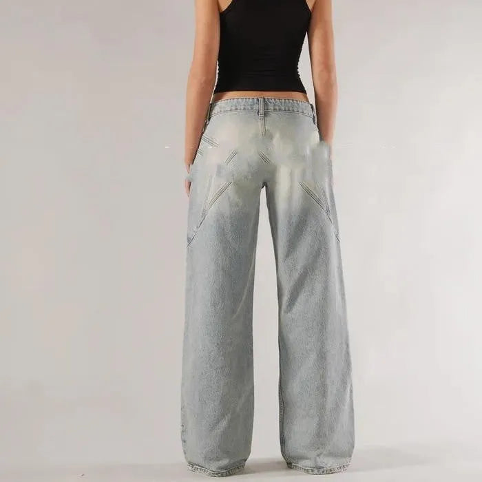 Women's blue cotton wide leg mop trousers with low waist and splicing detail laid flat.