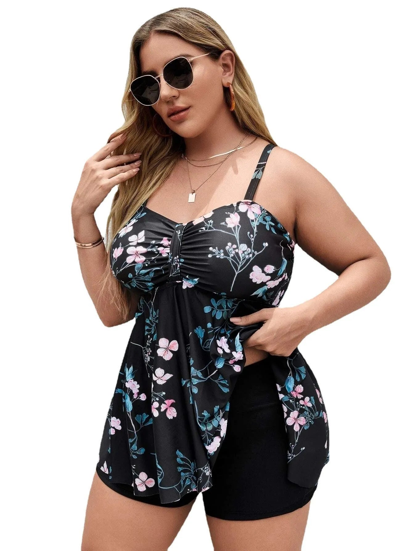 Women's floral print one-piece swimsuit on hanger, showing split colour design.