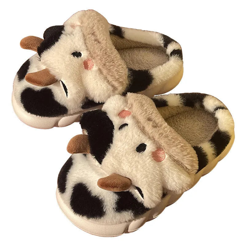White cartoon cow slippers for women with fluffy faux fur and a textured non-slip sole.