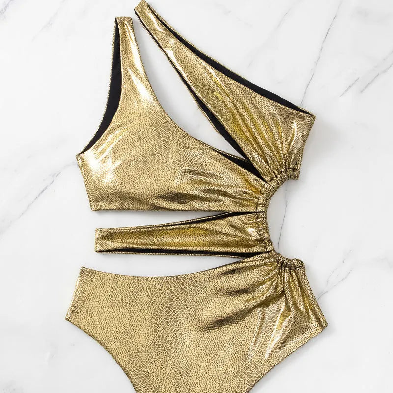 Gold coloured backless one-piece swimsuit for women on a white background