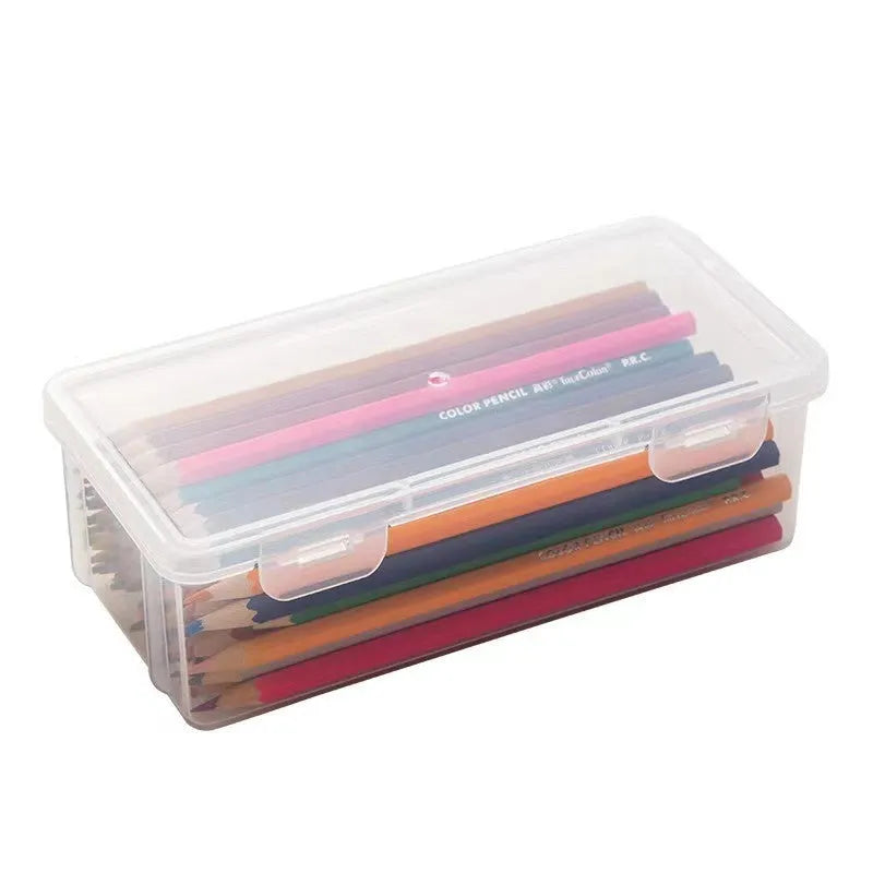 Transparent plastic stationery storage box showing pencils and art supplies inside