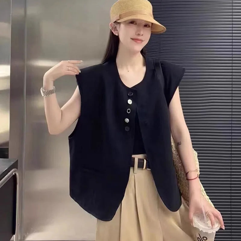 Women's loose fit vest in black with pocket detail and short length
