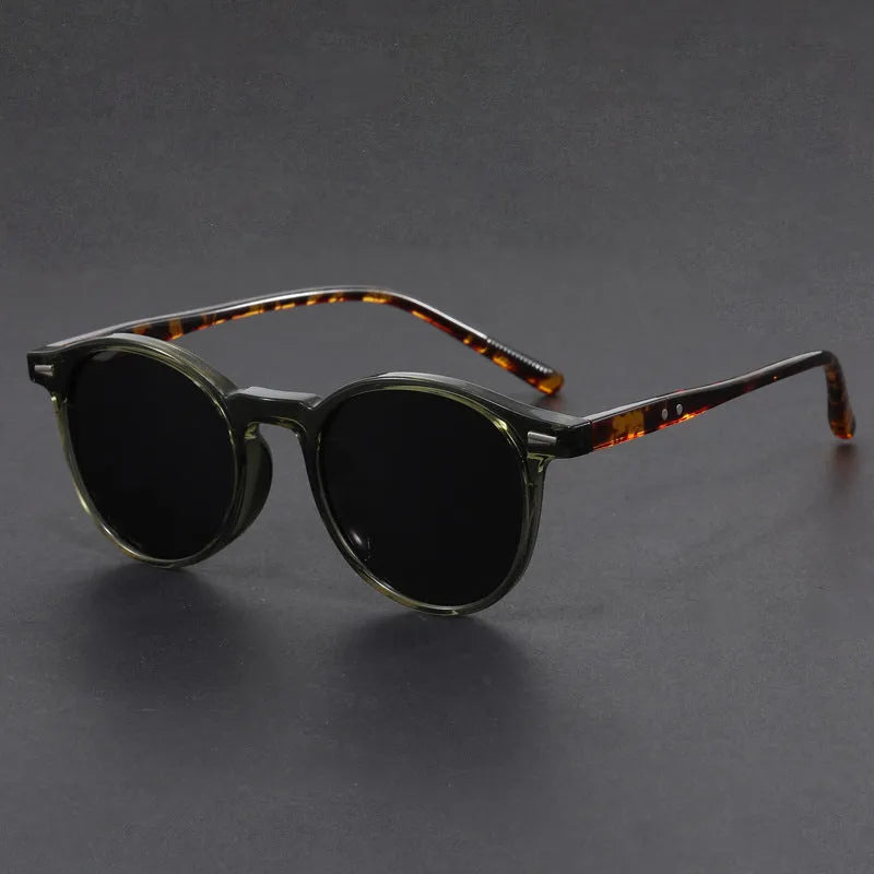 Ultra-light round frame retro sunglasses with polarised gray lenses in multiple colours including sand black, bright black, and gray