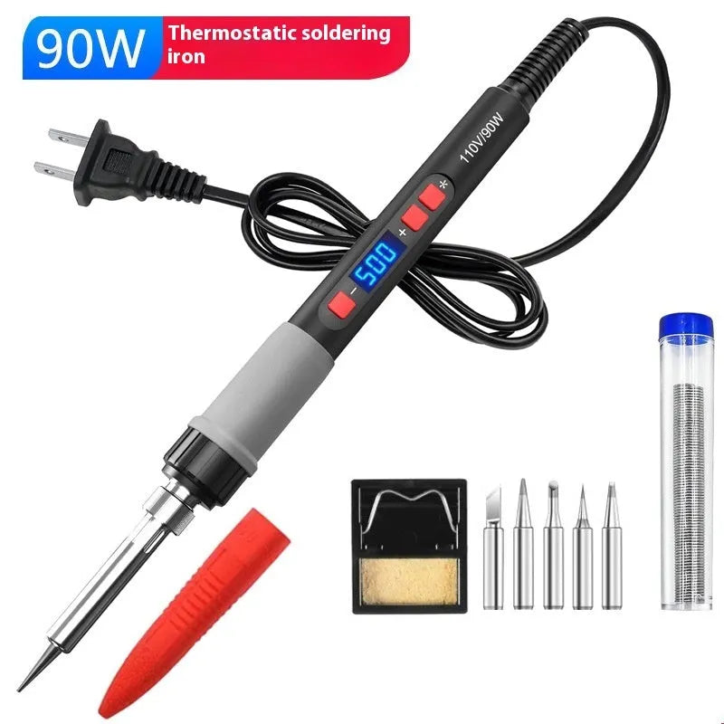 Grey 90W electric soldering iron with ceramic heating core, five tips, sponge, and solder on a workbench.