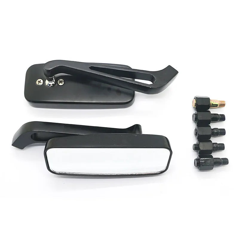 Pair of motorcycle rearview mirrors with glass surface and aluminium alloy cover in retro decor setting