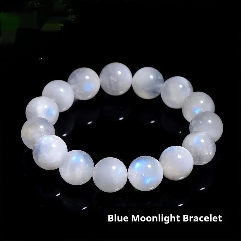 Natural blue moonstone round bead bracelet with white accents showing polished stone surface