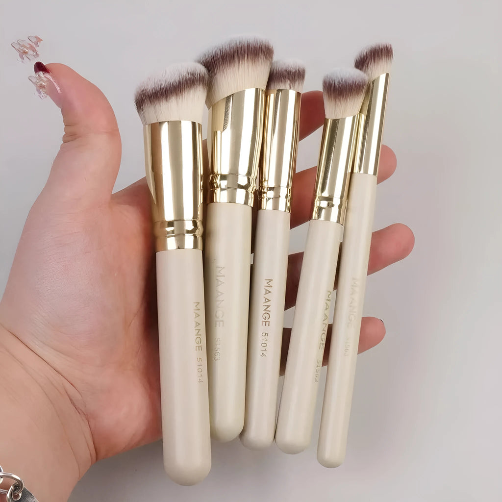 Five angled makeup brushes with apricot handles for powder, foundation and blush application