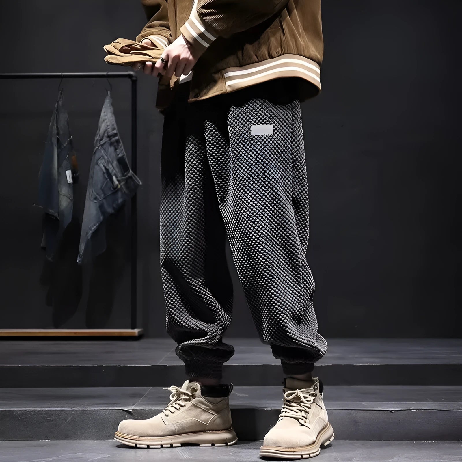 Grey men's straight-leg sweatpants with ankle ties laid flat.