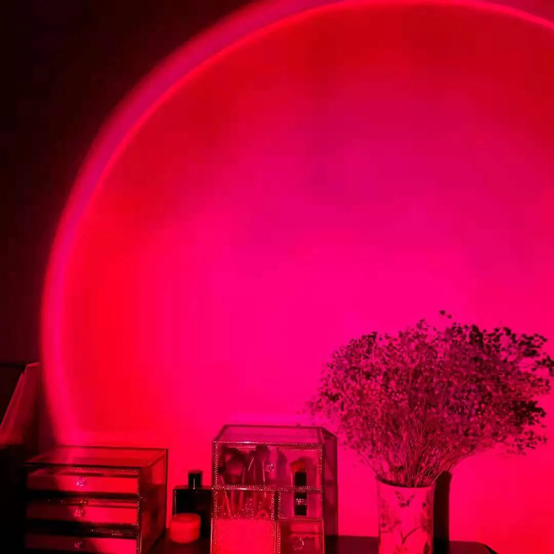 Rechargeable sunset projection lamp with USB cable showing rainbow and red light effect.