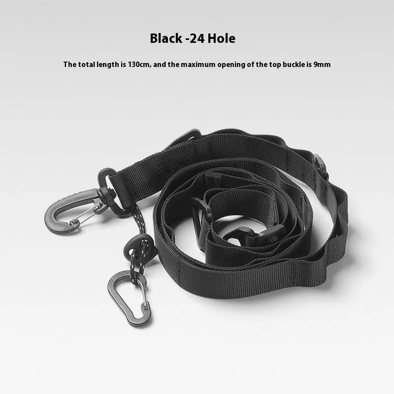 Outdoor multifunctional hanging rope clothesline storage belt in black on a green camping table